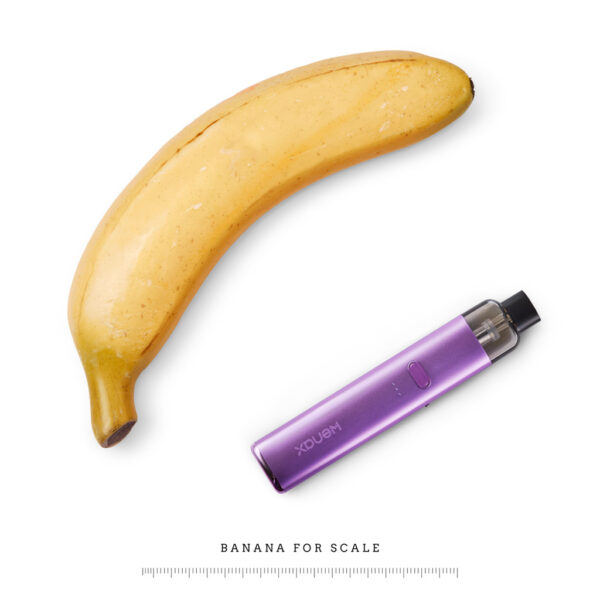 GeekVape Wenax K2 Pod Kit GeekVape Wenax K2 Pod Kit photographed beside a banana for scale, showing how slim the violet device is.